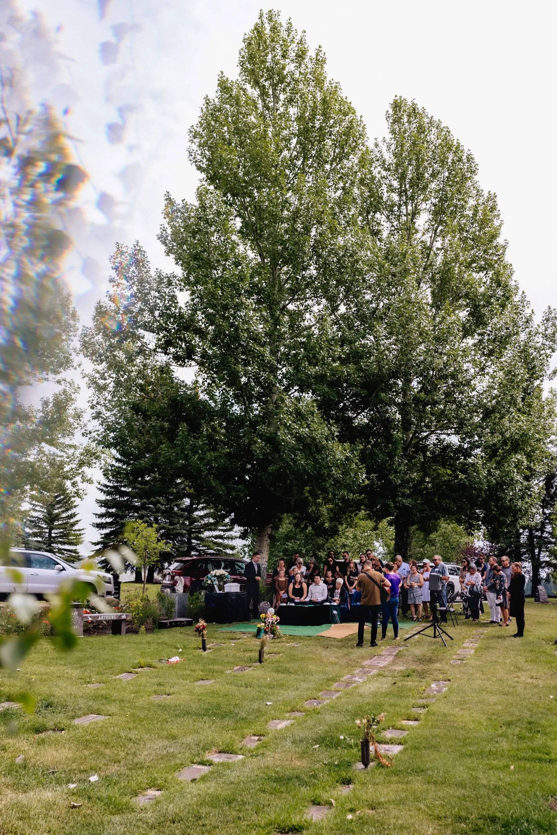 Traditional graveside funeral service at a cemetery in Lethbridge